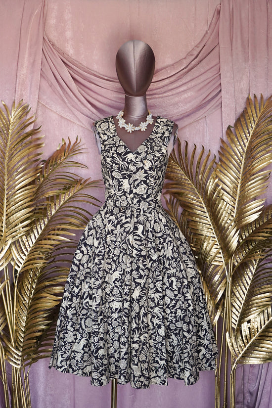 Load image into Gallery viewer, 1950s &amp;quot;It&amp;#39;s a Jor&amp;#39;elle Model&amp;quot; Mexican Navy/Animal Print Dress with sequins.
