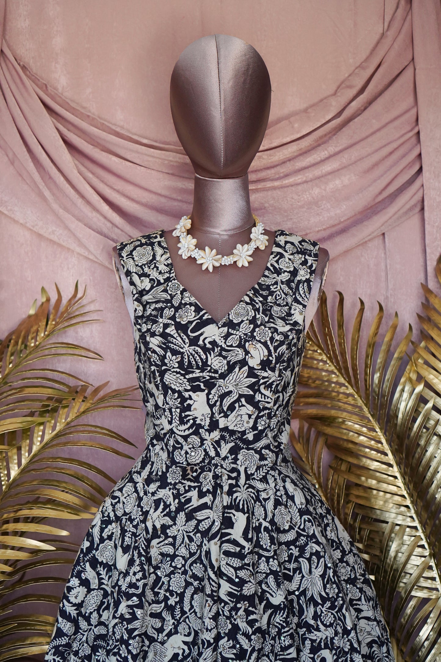 Load image into Gallery viewer, 1950s &amp;quot;It&amp;#39;s a Jor&amp;#39;elle Model&amp;quot; Mexican Navy/Animal Print Dress with sequins.
